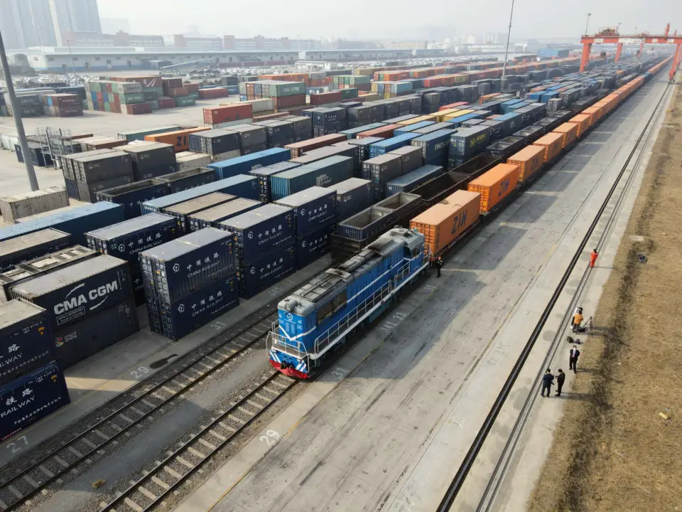 A freight train leaves Zhengzhou, central China’s Henan province, for Katowice, Poland, February 10, 2021. (Photo by Li Zhangpeng/People’s Daily Online)