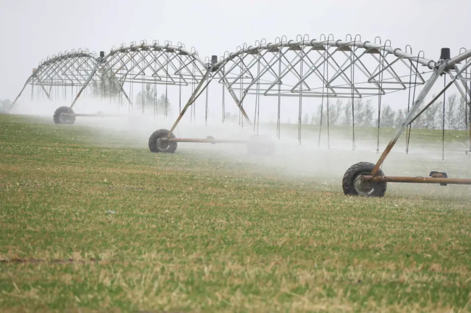 Machines are watering a man-made grassland in Ar Horqin Banner, Chifeng, north China's Inner Mongolia Autonomous Region, May 3, 2020. (Photo by Li Fu/People's Daily Online)