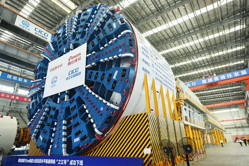 A 15-meter diameter super-large shield tunneling machine that can balance water and mud roll off the production line in east China's Zhejiang province, May 9, 2021. (Photo by Long Wei/People's Daily)