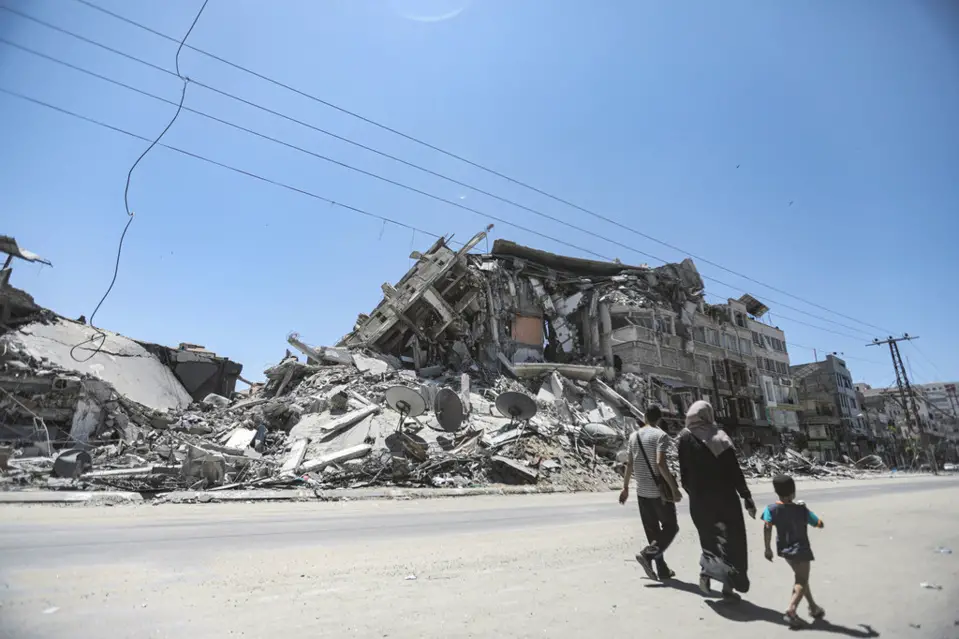 Un bâtiment endommagé par une frappe aérienne israélienne dans la ville de Gaza. Crédits : UNRWA/Mohamed Hinnawi
