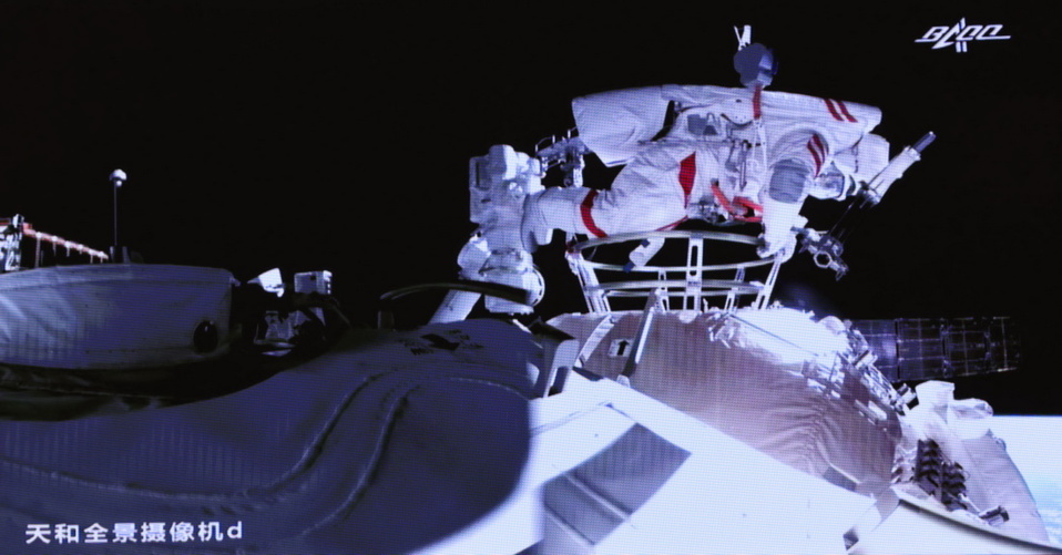 Screen image taken at Beijing Aerospace Control Center on July 4, 2021, shows Chinese astronaut Liu Boming conducting extravehicular activities (EVAs) out of the core module Tianhe of China’s space station. (Photo by Jin Liwang/Xinhua)