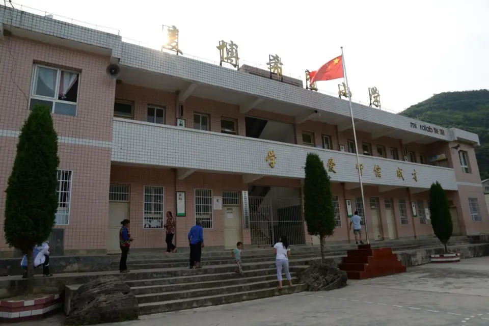 Photo taken on June 26, 2016, shows a primary school at Caowangba village, Zunyi, southwest China’s Guizhou province. Originally initiated by Huang Dafa, the school guaranteed the primary education of 100 children in the village when it was first established. In recent years, the school has been improved and transformed thanks to investments from companies. (Photo by Luo Xinghan/People’s Daily Online)