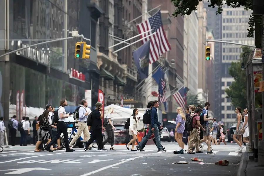 People walk on a street in New York, the United States, on July 20, 2021. (Xinhua/Wang Ying)