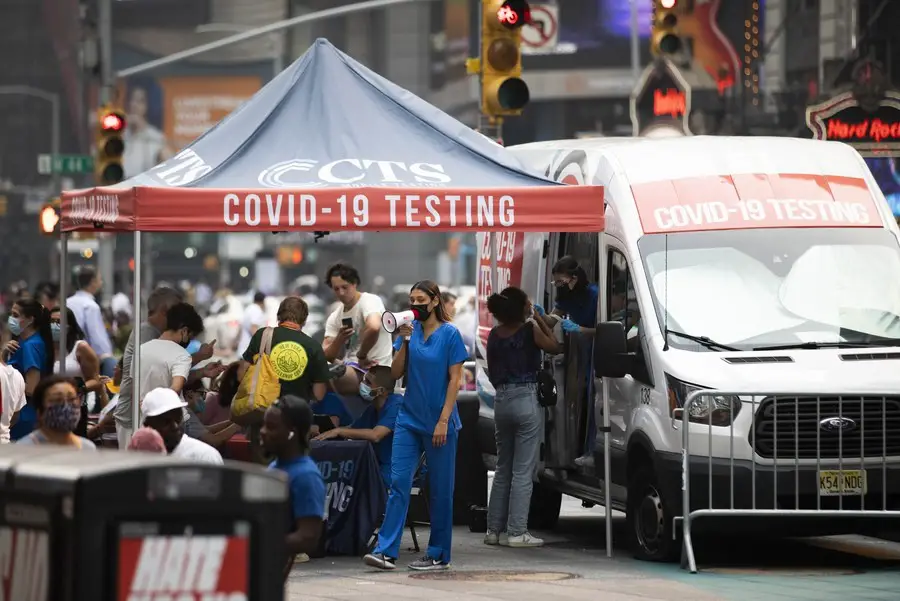 People receive COVID-19 tests at a mobile testing site in Times Square, New York, the United States, on July 20, 2021. (Xinhua/Wang Ying)