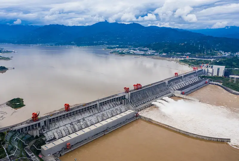 The Three Gorges Dam in central China’s Hubei province opens three spillways to discharge floodwater, allowing the passage of the first flood of China’s Yangtze River this year, Sept. 7, 2021. (Photo by Zheng Jiayu/People’s Daily Online)