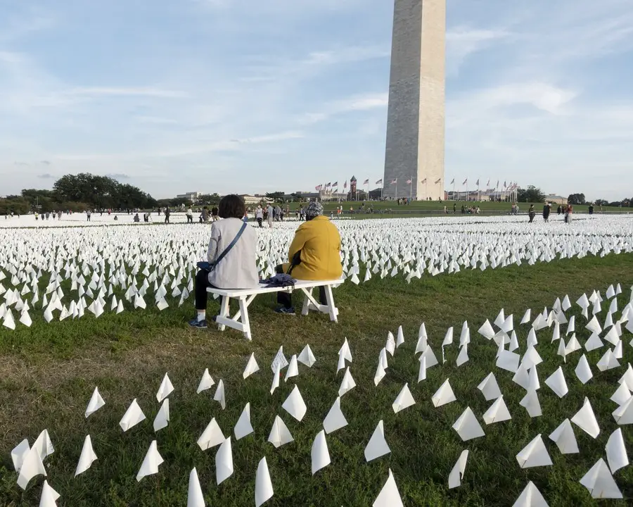 White flags honoring the lives lost to COVID-19 are seen on the National Mall in Washington, D.C., the United States, on Oct. 2, 2021. (Xinhua/Liu Jie)