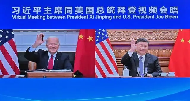Chinese President Xi Jinping meets with U.S. President Joe Biden via video link, in Beijing, Nov. 16, 2021. (Photo by Yue Yuewei/Xinhua)