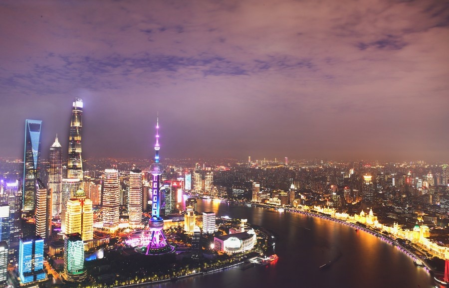 The multiple exposure photo taken on Oct. 26, 2020 shows the night view along the Huangpu River in east China's Shanghai. (Xinhua/Fang Zhe)
