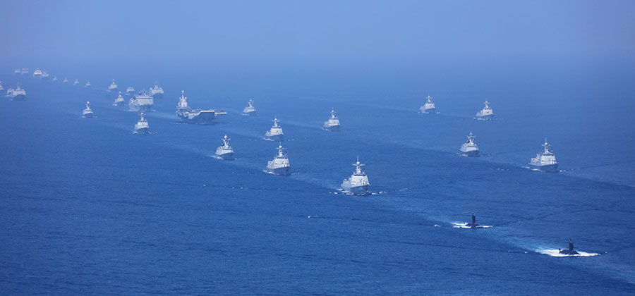 The aircraft carrier Liaoning, submarines, vessels and fighter jets take part in a review in the South China Sea on April 12, 2018. (Xinhua/Mo Xiaoliang)