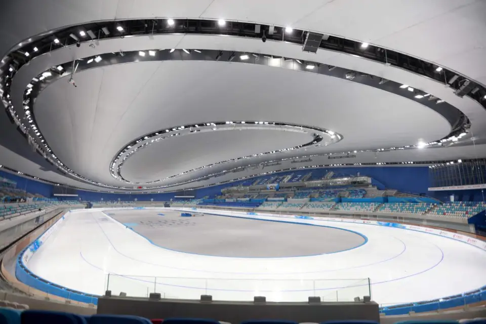 Photo taken on Nov. 4, 2021 shows the interior of the National Speed Skating Oval in Beijing, capital of China. With a floor area of about 80,000 square meters and a height of 33 meters, the main building of the National Speed Skating Oval has a seating capacity of around 12,000 people. (Photo by Chen Xiaogen/People’s Daily Online)