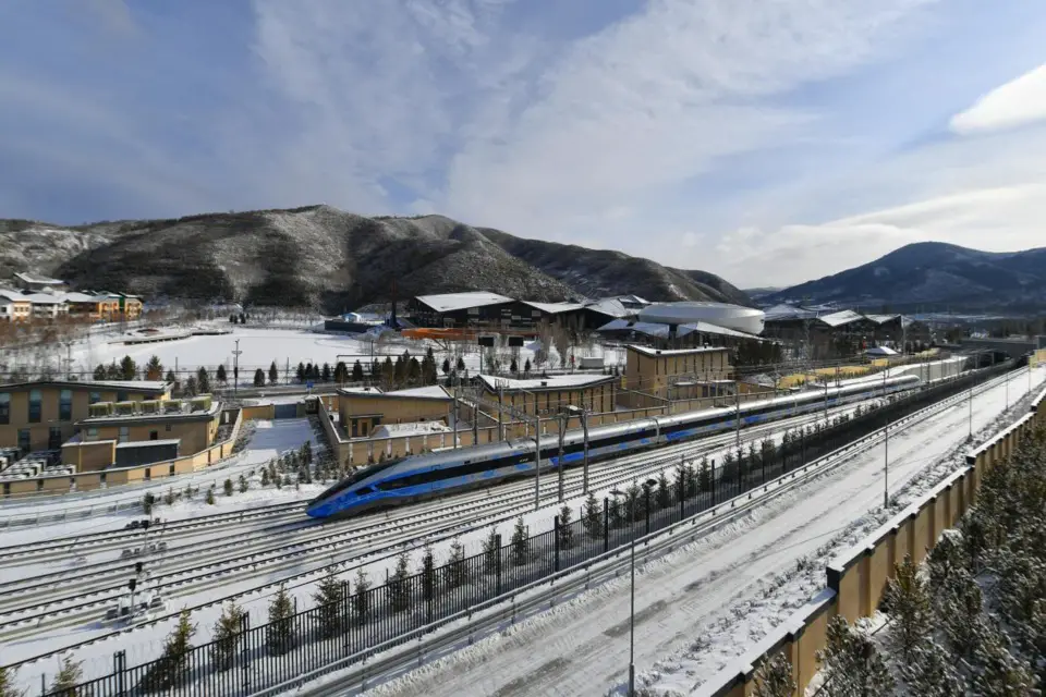 A dedicated Winter Olympic intelligent bullet train passes through the Zhangjiakou competition zone of the Beijing 2022 Olympic and Paralympic Winter Games, Jan. 12, 2022. (Photo by Sun Lijun/People’s Daily Online)