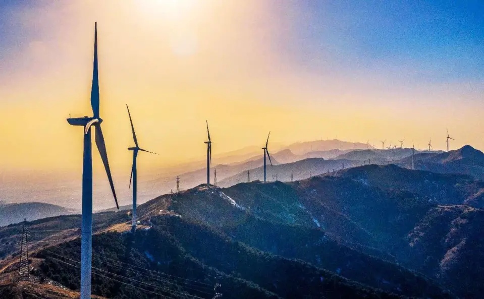 Photo taken on Feb. 26, 2022 shows wind turbines in Zhongtiao Mountain, Ruicheng county, Yuncheng, north China's Shanxi province. (Photo by Xue Jun/People's Daily Online)