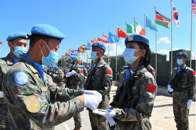 All 410 members of the 19th batch of Chinese peacekeeping force to Lebanon are awarded the United Nations Peace Medal of Honor during a ceremony at the Chinese troops’ camp in Hanniyah village in southern Lebanon, June 16, 2021. All 410 members of the 19th batch of Chinese peacekeeping force to Lebanon are awarded the United Nations Peace Medal of Honor during a ceremony at the Chinese troops’ camp in Hanniyah village in southern Lebanon, June 16, 2021.