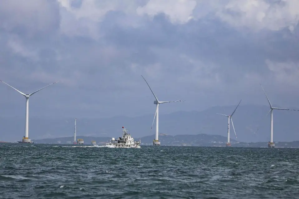 Photo taken on July 20, 2021 shows an offshore wind power generation project at the Pingtan Comprehensive Experimental Zone, east China’s Fujian province. (Photo by Xie Guiming/People’s Daily Online)