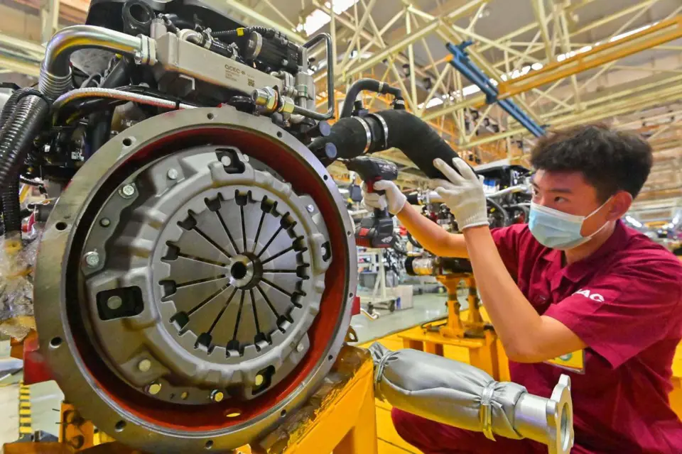 A worker assembles automobiles at a factory of Chinese car maker JAC Group’s branch in Qingzhou city, east China’s Shandong province, April 27, 2022. (Photo by Wang Jilin/People’s Daily Online)