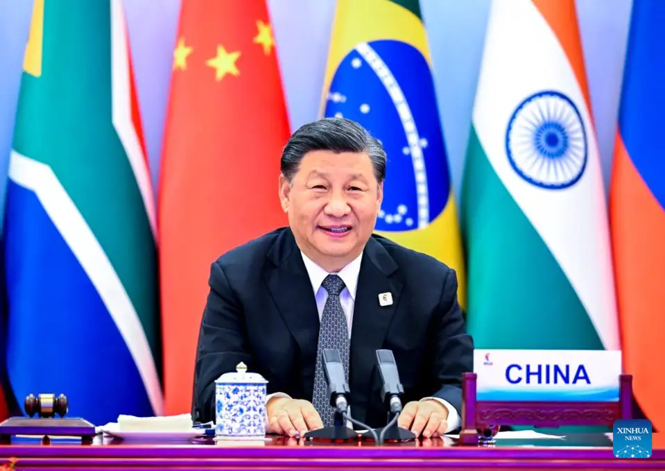 Xi delivered remarks titled "Fostering High-quality Partnership and Embarking on a New Journey of BRICS Cooperation" at the summit. (Xinhua/Li Xueren)