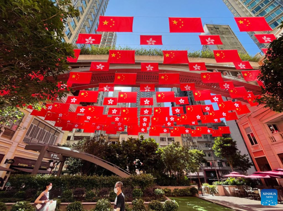 China's national flags and the Hong Kong Special Administrative Region (HKSAR) flags fly along the Lee Tung Avenue in Hong Kong, south China, June 28, 2022. July 1 this year marks the 25th anniversary of Hong Kong's return to the motherland. (Xinhua/Li Gang)