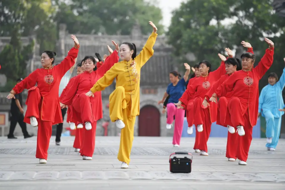 People practice a martial art routine on a square in Bozhou, east China's Anhui province, June 21, 2022. (Photo by Zhang Yanlin/People’s Daily Online)