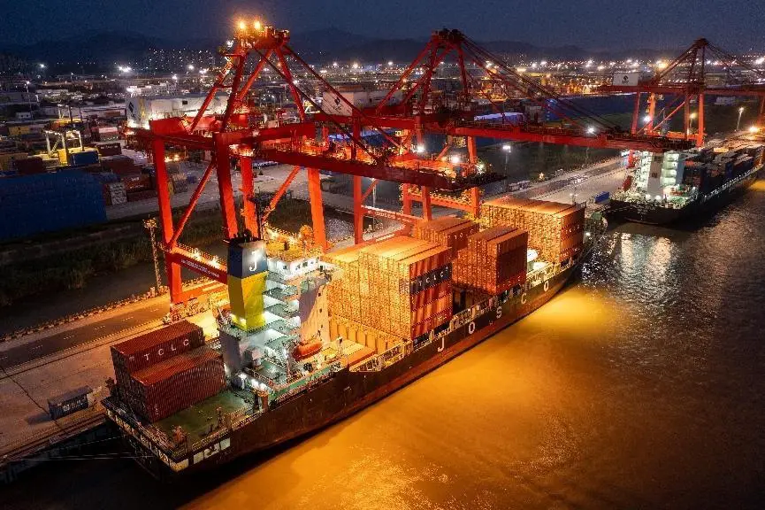 A container vessel docks at a terminal in Nanjing, east China’s Jiangsu province, June 19, 2022. (Photo by Fang Dongxu/People's Daily Online)