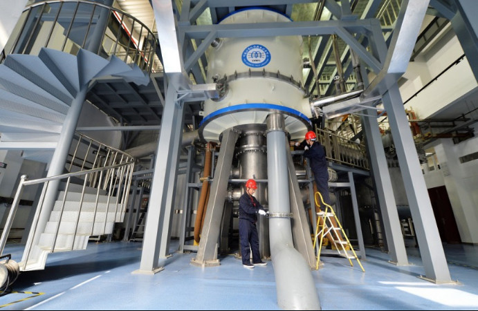 Scientific staff adjust the Steady High Magnetic Field Facility at the High Magnetic Field Laboratory, Chinese Academy of Sciences, Heifei, east China's Anhui province. (Photo by Xu Minhao/People's Daily Online)