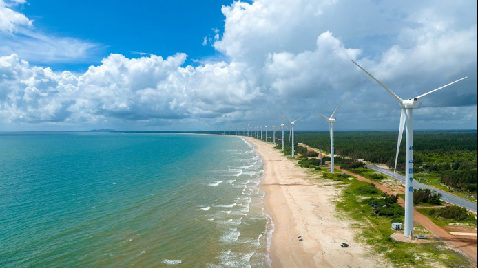 Wind turbines are seen in Mulan Bay of Wenchang, south China's Hainan province, striving for China's "dual carbon" goals, July, 2022. (Photo by Yuan Chen/People's Daily Online)