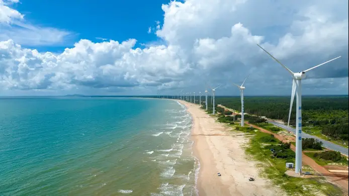 Wind turbines are seen in Mulan Bay of Wenchang, south China's Hainan province, striving for China's "dual carbon" goals, July, 2022. (Photo by Yuan Chen/People's Daily Online)
