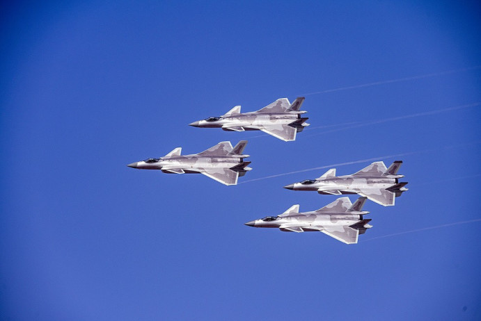 China's J-20 stealth fighter jets take part in a flying display at the Airshow China 2022, or the 14th China International Aviation and Aerospace Exhibition in Zhuhai, south China's Guangdong province, Nov. 13, 2022. (Photo by Deng Guohui/People's Daily Online)