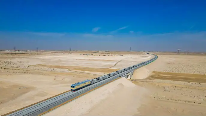 A ballast train runs along a line in Section B of the second stage of the Etihad Rail national rail network in the United Arab Emirates. (Photo courtesy of China Civil Engineering Construction Corporation)