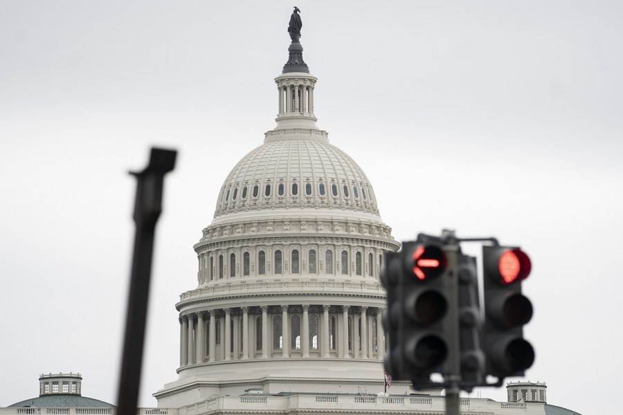 Photo taken on May 28, 2021 shows the U.S. Capitol building behind traffic lights in Washington, D.C., the United States. (Xinhua/Liu Jie)