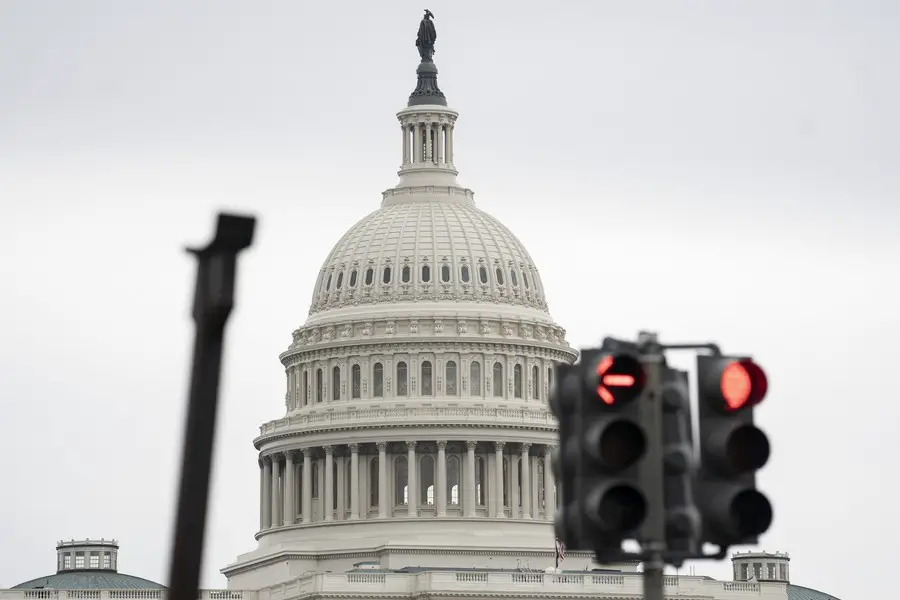 Photo taken on May 28, 2021 shows the U.S. Capitol building behind traffic lights in Washington, D.C., the United States. (Xinhua/Liu Jie)