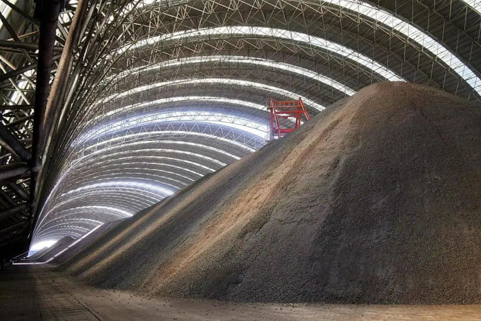 Photo shows a coal storage yard covered by a steel structure in the Caofeidian port in north China's Hebei province. (Photo from China Transport News)