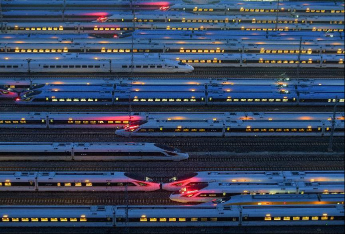 Photo taken on June 20, 2023 shows high-speed trains in Nanjing, east China's Jiangsu province. (Photo by Fang Dongxu/People's Daily Online)