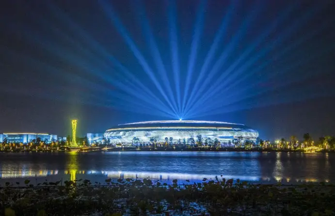 The main venue of the 31st FISU Summer World University Games in the Dong'an Lake Sports Park, Chengdu, southwest China's Sichuan province is lighted, July 8, 2023. (Photo by Zhang Guosheng/People's Daily Online)