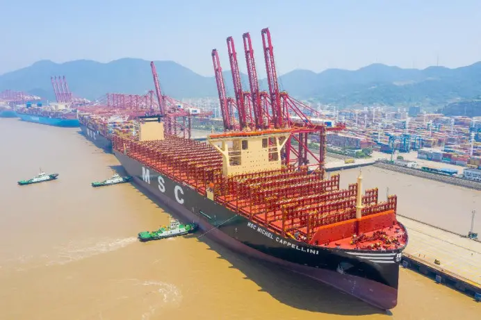 Ultra-large container ship MSC Michel Cappellini sails slowly into a berth with the help of tugboats at the container terminal of the Chuanshan port area of Ningbo-Zhoushan Port in east China's Zhejiang province, June 2, 2023. (Photo by Jiang Xiaodong/People's Daily Online)