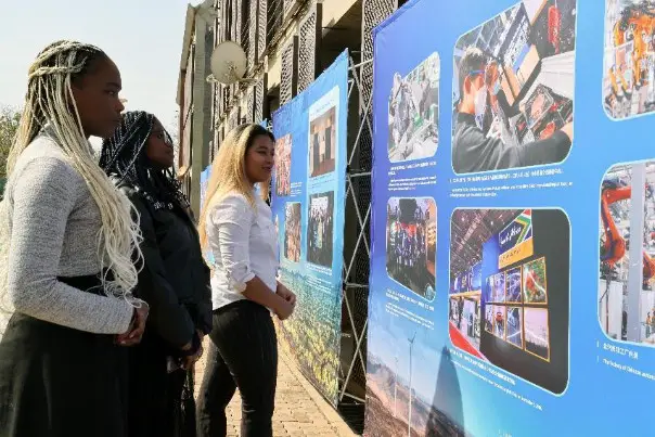 A photo exhibition is held by the Chinese Embassy in South Africa to review the highlights of China-South Africa exchanges, Aug. 18, 2023. (Photo by Guan Kejiang/People's Daily)