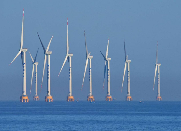 Photo shows a wind farm of China Huadian Corporation Ltd., a major state-owned power producer, in Aiwan Bay of Yuhuan city, east China's Zhejiang province. (Photo by Duan Junli/People's Daily Online)