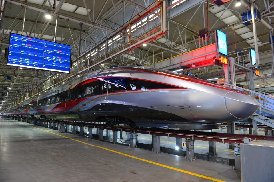 A Fuxing bullet train awaits maintenance in Xi'an, northwest China's Shaanxi province. (Photo by Tang Zhenjiang/People's Daily Online)