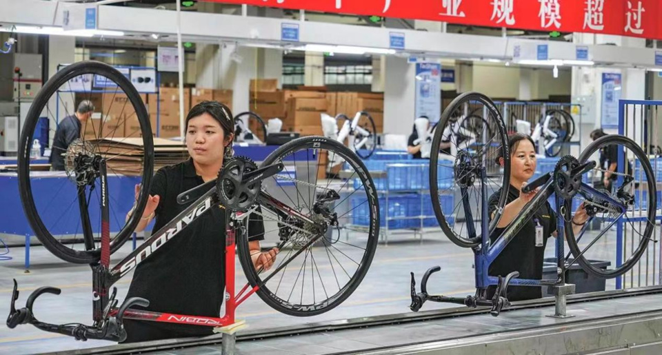 Bikes are tuned in a workshop of Chinese sports equipment manufacturer Taishan Sports. (Photo by Jia Peng)