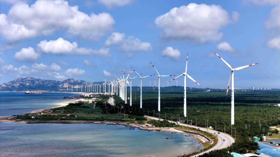 Photo taken on July 15 shows wind turbines spinning in the wind in Rongcheng city, east China's Shandong province. (Photo by Yang Zhili/People's Daily Online) Photo taken on July 15 shows wind turbines spinning in the wind in Rongcheng city, east China's Shandong province. (Photo by Yang Zhili/People's Daily Online)