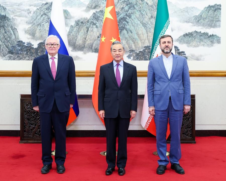 Chinese Foreign Minister Wang Yi, also a member of the Political Bureau of the Communist Party of China Central Committee, meets with Russian Deputy Foreign Minister Ryabkov Sergey Alexeevich and Iranian Deputy Foreign Minister Kazem Gharibabadi in Beijing, capital of China, March 14, 2025.  (Xinhua/Liu Bin)