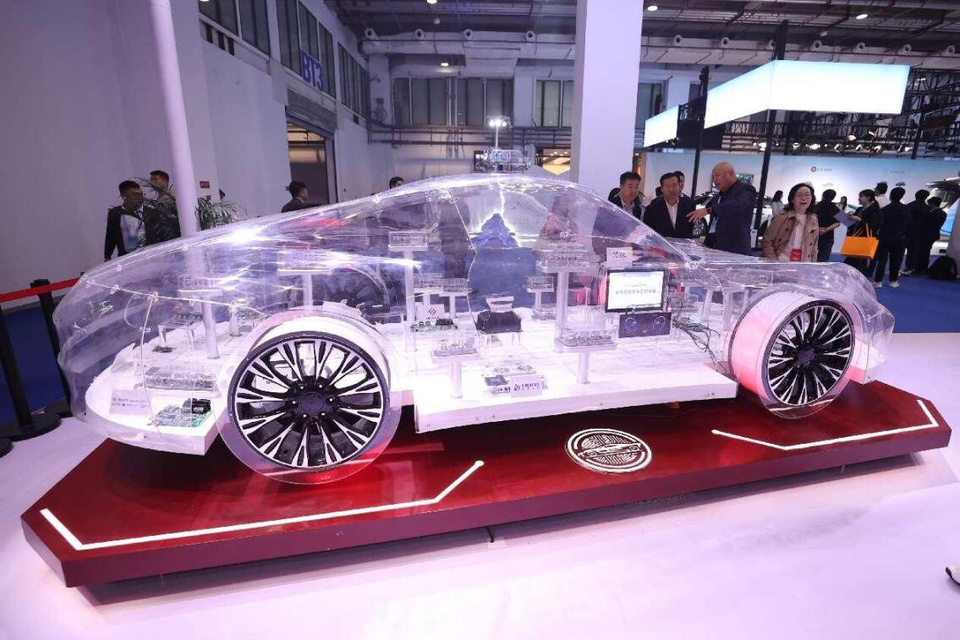 Visitors explore automotive chips at the 2024 World Intelligent Connected Vehicles Conference in Beijing, Oct. 17, 2024. (Photo by Chen Xiaogen/People's Daily Online)