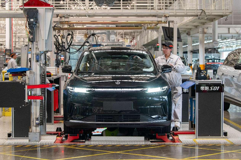 A new energy vehicle goes through quality check after being assembled in a smart workshop of Chinese carmaker Leapmotor in Jinhua, east China's Zhejiang province, April 2, 2025. (Photo by Hu Xiaofei/People's Daily Online)