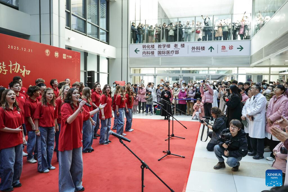 One Voice Children's Choir from the United States performs at the Peking Union Medical College Hospital (PUMCH) in Beijing, capital of China, Dec. 31, 2025. Fifty-six young performers from One Voice Children's Choir along with invited musicians gave a performance at the hospital on Wednesday. (Xinhua/Zhang Yuwei)