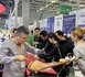 Visitors taste Spain's Iberian ham at the 8th China International Import Expo, Nov. 5, 2025. (People's Daily/Jiang Bo)