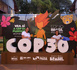 Tourists post for a picture with a COP30-themed installation in Belem, Brazil. (People's Daily/Shi Yuanhao)